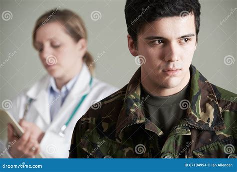 Soldier And Doctor Shaking Hands On White Background Stock Photography