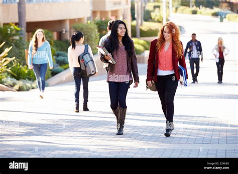 Female Students Walking Outdoors On University Campus Stock Photo Alamy