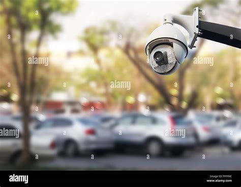 Closeup Image Of Cctv Security Camera Outdoor At Car Park Stock Photo