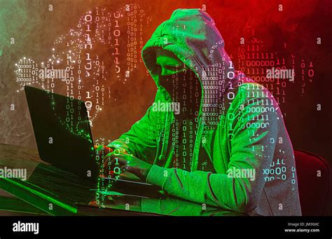 Hooded Computer Hacker Stealing Information With Laptop Stock Photo Alamy