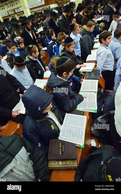 Young yeshiva students attend Chanukkah candle lighting services at the ...