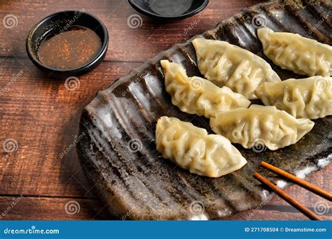 Traditional Asian Cuisine Fried Gyoza Balls With Dipping Sauce