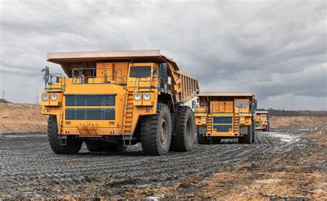 Large Quarry Dump Truck Big Yellow Mining Truck At Work Site Loading