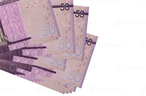 50 Dominican pesos bills lies in small bunch or pack isolated on white ...