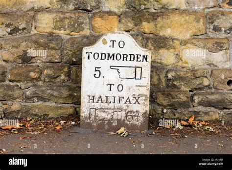 An traditional stone milestone marker in Haden Bridge, West Yorkshire ...