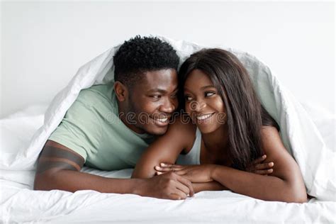 Portrait Of Smiling Glad Millennial African American Husband And Wife