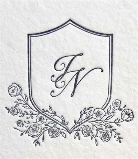 The Monogrammed Letter F Is Surrounded By Flowers And Leaves On A White