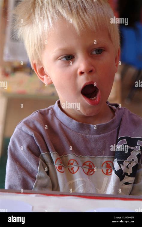 Little Boy Yawning Stock Photo Alamy