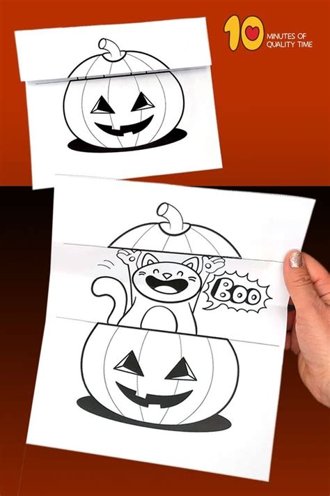 A Hand Holding Up A Paper With A Drawing Of A Cat In A Pumpkin Costume