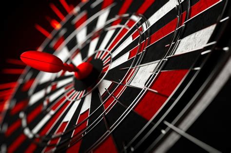 Premium Photo Dart Hitting The Center Of Bulls Eye Target With Red