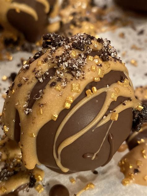 Oreo Truffles With A Sea Salt Caramel Drizzle Topped With Gold