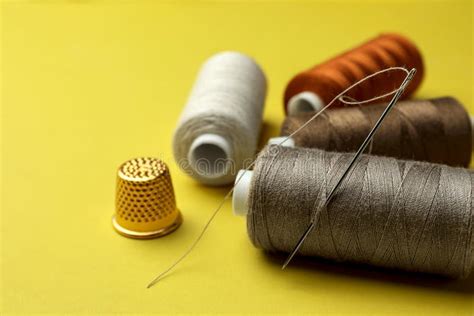 Thimble And Needle With Sewing Thread Isolated On White Stock Image