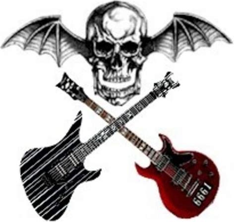 Two Guitars And A Skull With Wings On Them Are Shown Next To Each Other