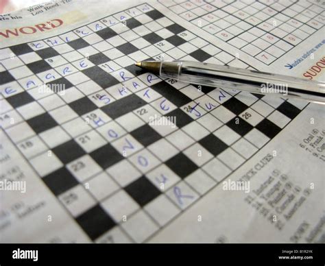 Close Up Picture Of A Crossword Puzzle With Pen Stock Photo Alamy