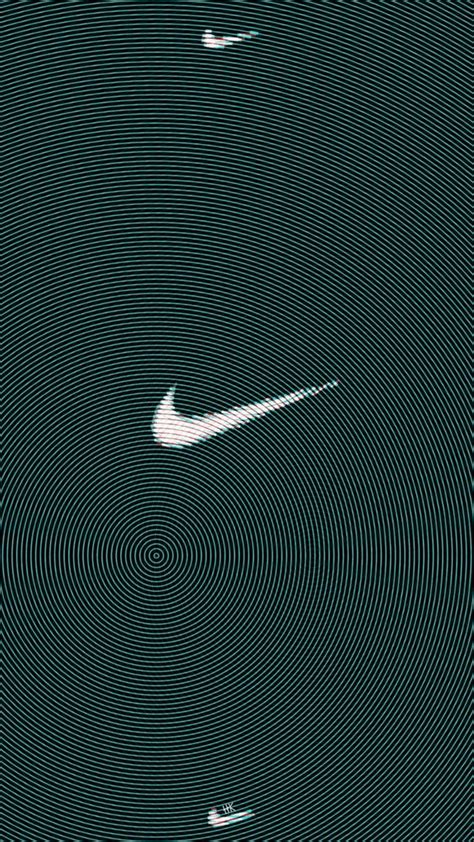 The Nike Logo Is Shown In White On A Green Background With Black And