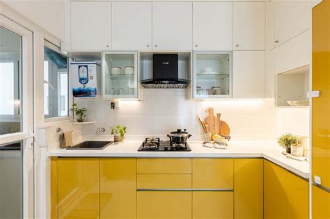 Compact L-Shaped Kitchen Design With Yellow Cabinets - 8x6 Ft | Livspace