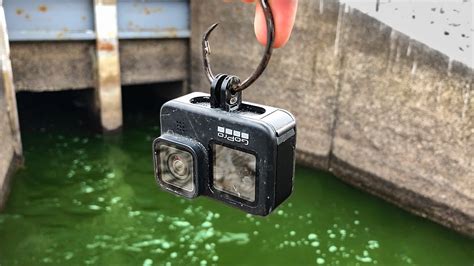 Dropping A Gopro Into A Deep Spillway Giant Fish Everywhere Youtube