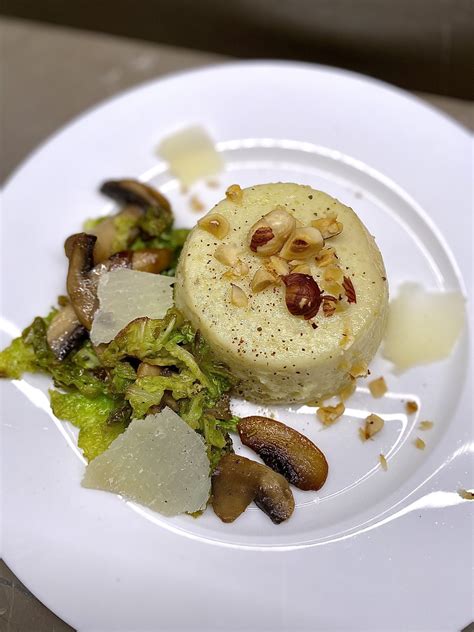 Flan Di Topinambur Con Funghi Verza Nocciole E Scaglie Di Parmigiano