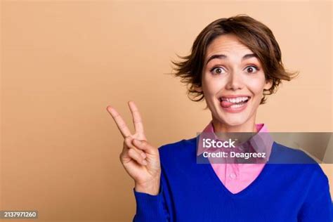 Photo Portrait Of Lovely Young Lady Show Vsign Stick Tongue Dressed