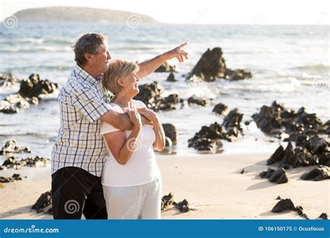 Lovely Senior Mature Couple On Their 60s Or 70s Retired Walking Happy