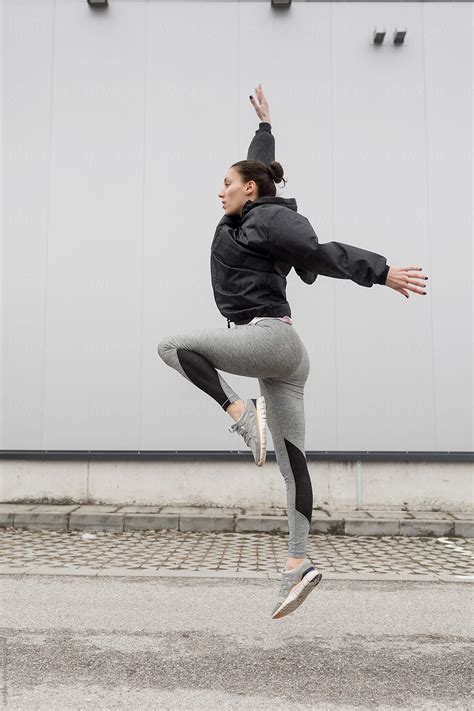 Female Athlete Stretching By Stocksy Contributor MEM Studio Stocksy