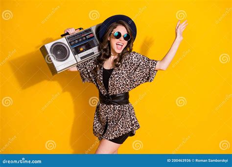 Photo Of Positive Cheerful Excited Energetic Girl Hold Retro Cassette