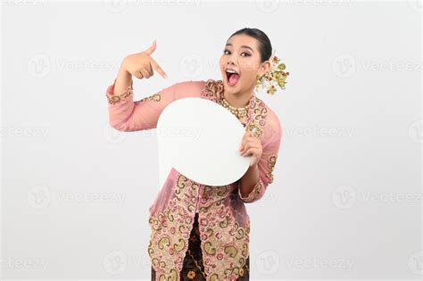 Young beautiful woman dress up in local culture in southern region pose with speech bubble ...