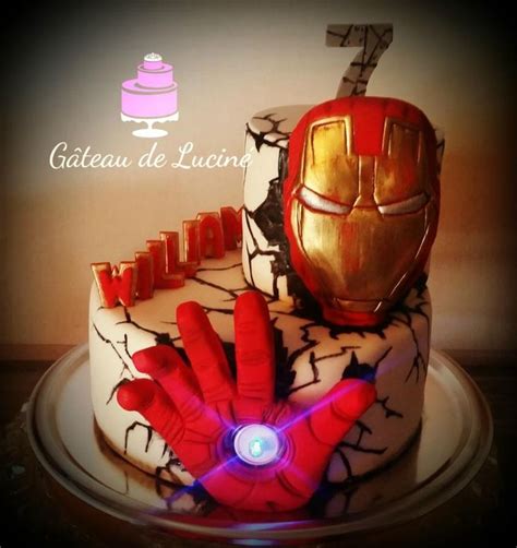 A Birthday Cake Decorated With Iron Man S Hands