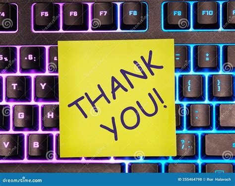 The Thank You Text Written On A Yellow Sticker Left On The Laptop