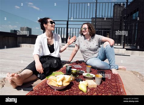 Woman with below-elbow amputation with her friend having a healthy meal ...