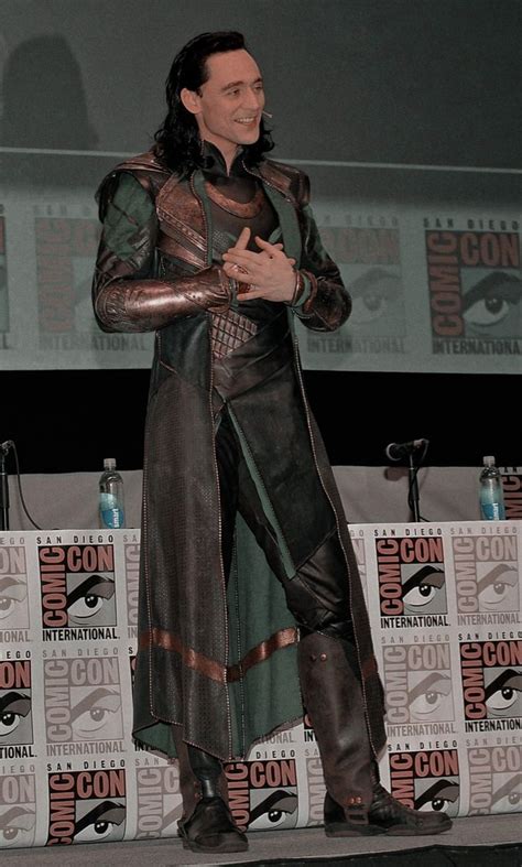 A Man Dressed As Loki In Front Of A Panel