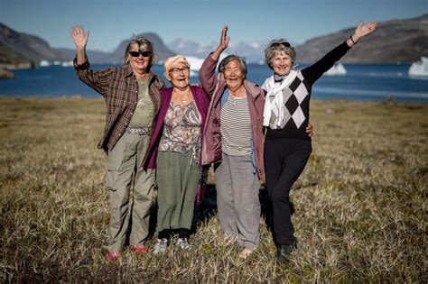 Four women waving hello in Narsaq in South Greenland. Photo by Mads Pihl