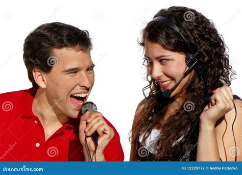 Couple Singing Singing Man And Girl In A Recording Studio Expressive