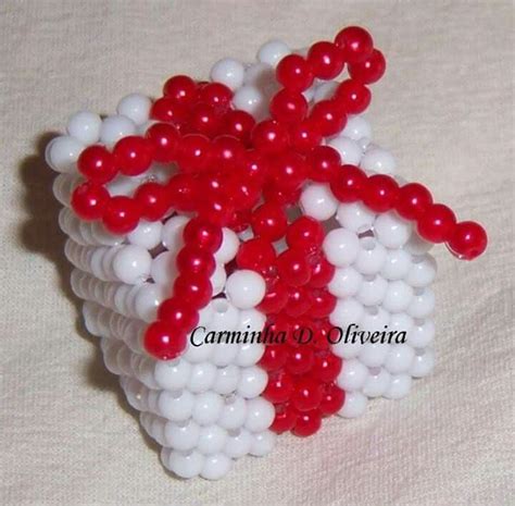 A Red And White Beaded Object On A Table