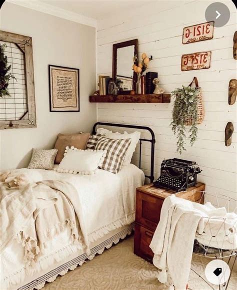 A Bed Room With A Neatly Made Bed And A Typewriter On The Wall Next To It