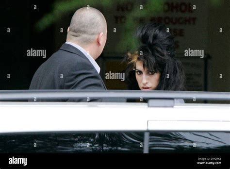 British Singer Amy Winehouse Right Arrives At Snaresbrook Crown Court In London Monday June