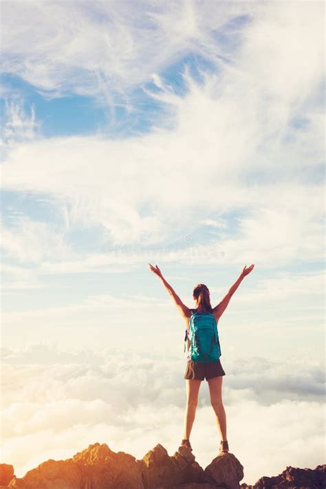 Happy Woman Hiker With Open Arms At Sunset On Mountain Peak Stock Image