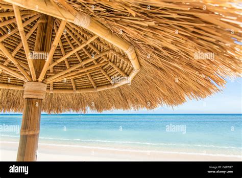 Straw Umbrella On A Beautiful Tropical Beach Stock Photo Alamy