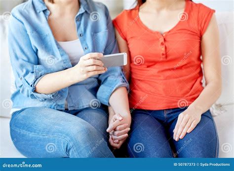 Close Up Of Lesbian Couple With Smartphone At Home Stock Image Image Of Indoors Communication
