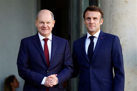 Macron Scholz Plaster Over Differences With Smiles And A Handshake