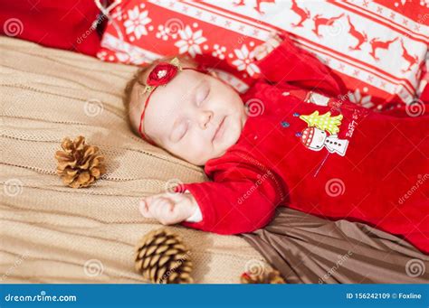 Cute Newborn Baby In A Christmas Costume On A Bed At Home Stock Image