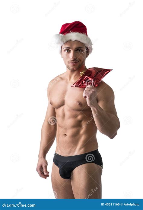 Christmas Season Muscular Bodybuilder In Santa Claus Hat Stock Photo