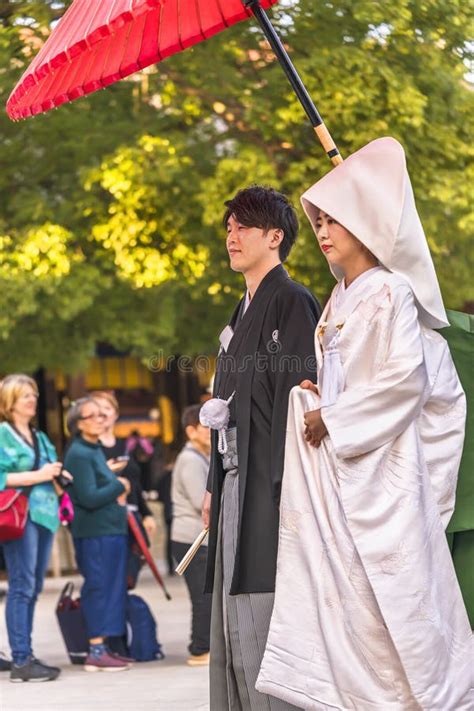 Traditional Procession Of A Japanese Shinto Wedding With A Couple In