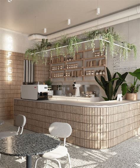 The Interior Of A Coffee Shop With Potted Plants On The Counter And