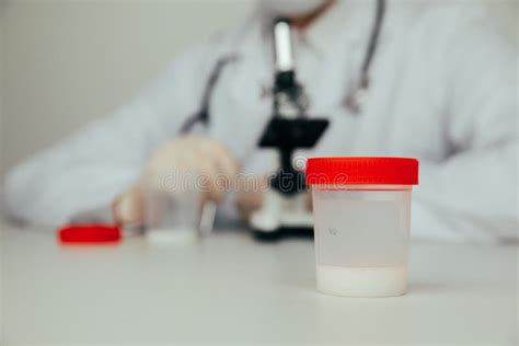 A Plastic Jar With Sperm For Semen Analysis Medical Test In Hospital