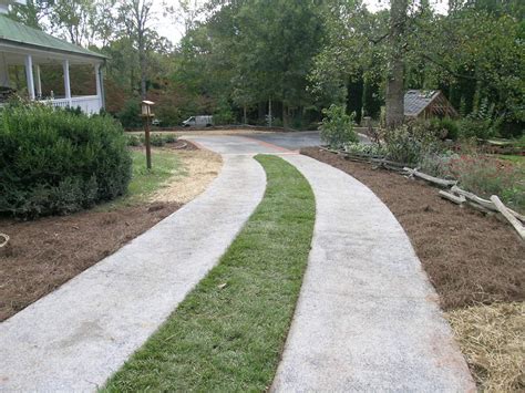 Exposed Aggregate Driveway With Grass Strip Traditional Landscape Atlanta By Legacy