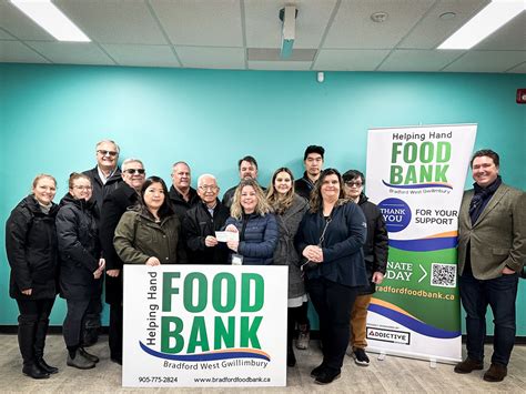 Bwg Presents 500 Donation To The Helping Hand Food Bank On Behalf Of