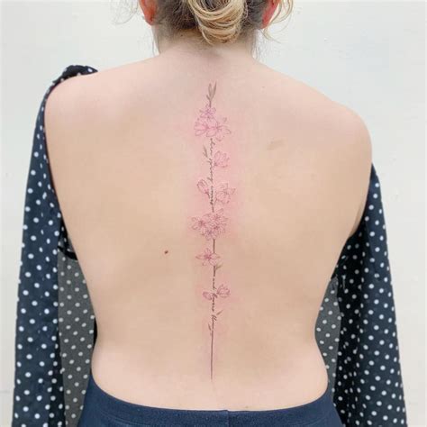 Elegant Spine Tattoos For Women That Symbol Of Strength Artofit