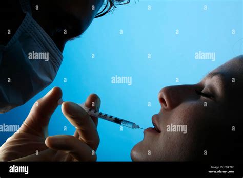 A woman's lips being enhanced with a collagen injection Stock Photo - Alamy