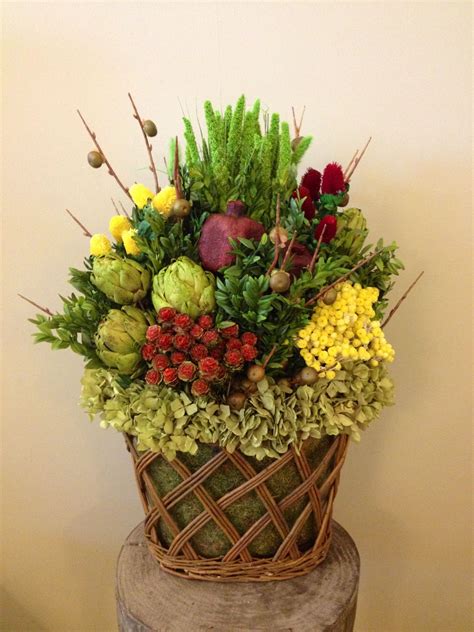 Custom Dried Floral Arrangement In Glass Woven Basket With Berry Sticks